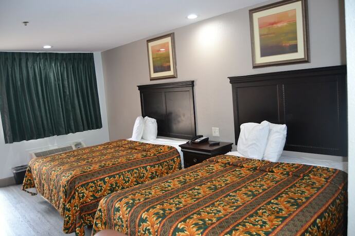 Imagen de la habitación del Hotel Deluxe Inn, Irving. Foto 10
