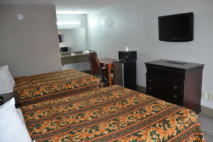 Imagen de la habitación del Hotel Deluxe Inn, Irving. Foto 14