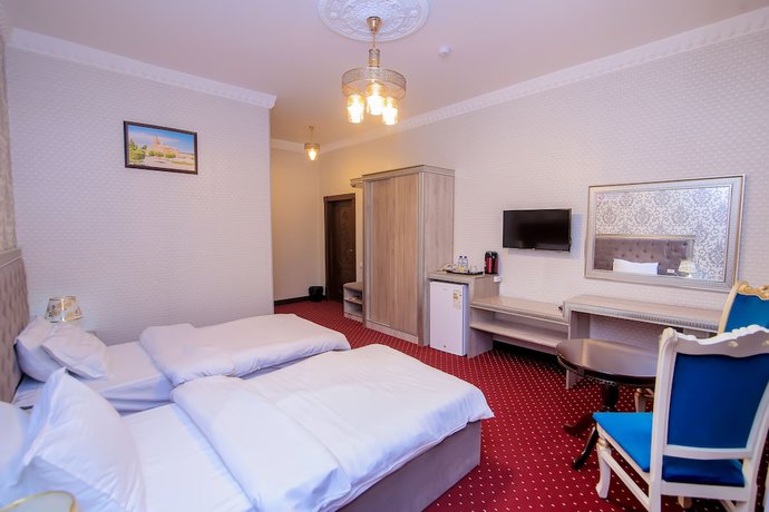 Imagen de la habitación del Hotel Dendi Plaza. Foto 13