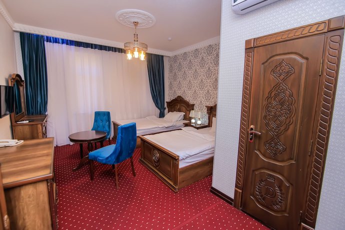 Imagen de la habitación del Hotel Dendi Plaza. Foto 14