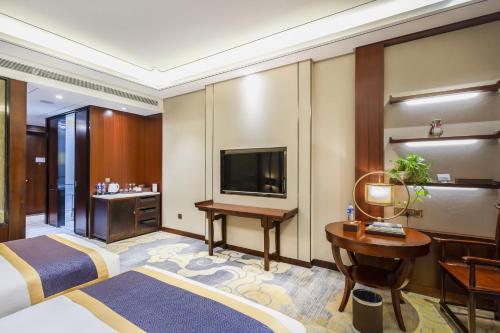 Imagen de la habitación del Hotel Dengfeng Zhongzhou Huading. Foto 13