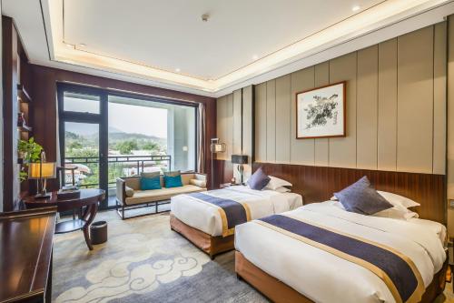 Imagen de la habitación del Hotel Dengfeng Zhongzhou Huading. Foto 15