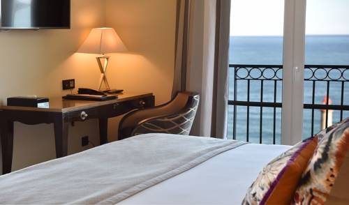 Imagen de la habitación del Hotel Des Gouverneurs. Foto 16