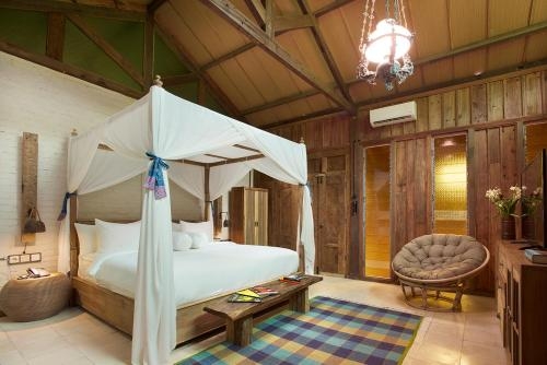 Imagen de la habitación del Hotel Desa Alamanis Resort Vila. Foto 8