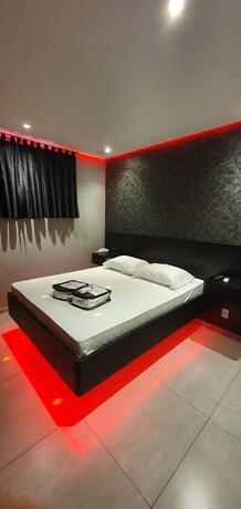 Imagen de la habitación del Hotel Desejo Motel. Foto 19