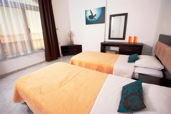 Imagen de la habitación del Hotel Desert Pearl Apartments. Foto 5