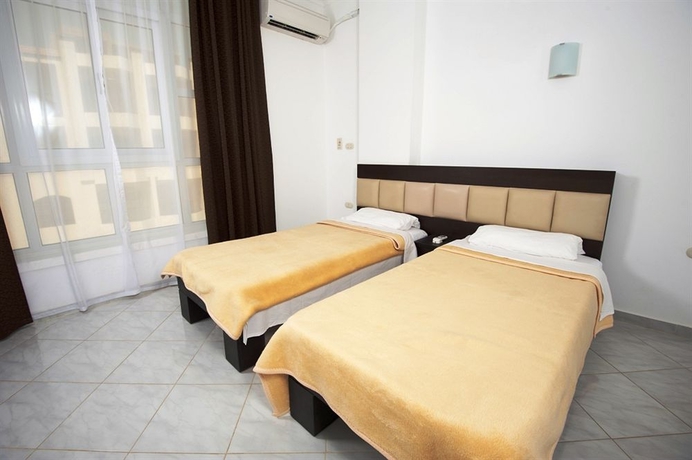 Imagen de la habitación del Hotel Desert Pearl Apartments. Foto 9
