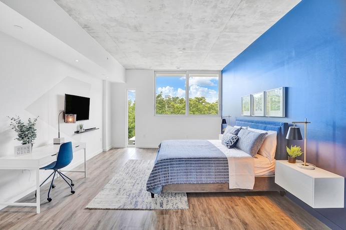 Imagen de la habitación del Hotel Design District Suites. Foto 13