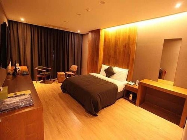 Imagen de la habitación del Hotel Designers Hotel The Rich. Foto 11