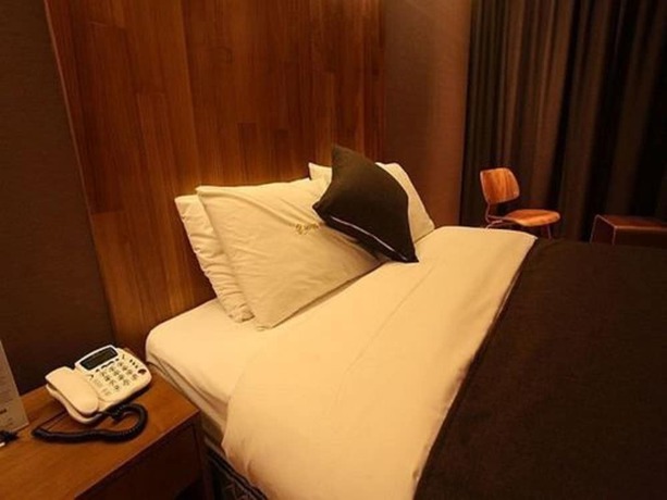 Imagen de la habitación del Hotel Designers Hotel The Rich. Foto 15