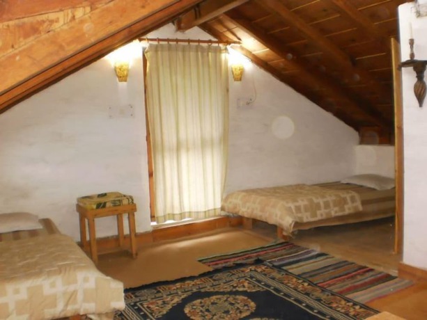 Imagen de la habitación del Hotel Dev Cottage. Foto 5