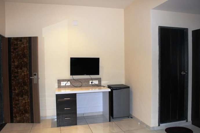 Imagen de la habitación del Hotel Dev Motel and Banquet. Foto 7