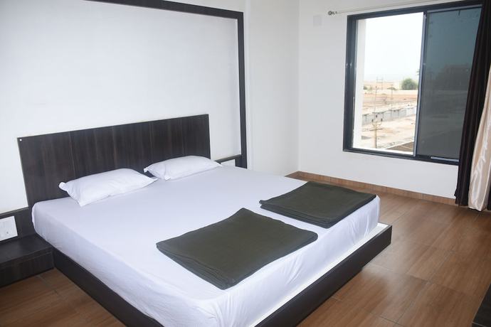 Imagen de la habitación del Hotel Devang. Foto 15