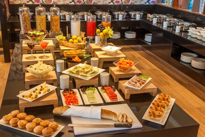 Imagen del bar/restaurante del Hotel Deventure Sarovar Portico Kapashera, New Delhi. Foto 5