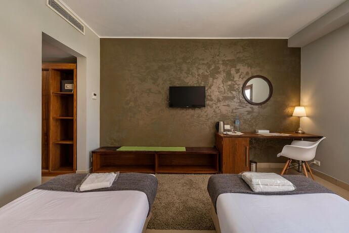 Imagen de la habitación del Hotel Dhara Residence E2 Lodge. Foto 12