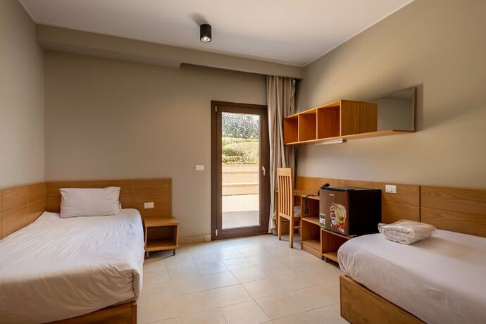 Imagen de la habitación del Hotel Dhara Residence E2 Lodge. Foto 18