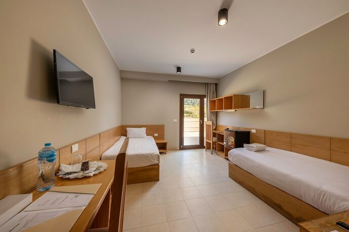 Imagen de la habitación del Hotel Dhara Residence E2 Lodge. Foto 19