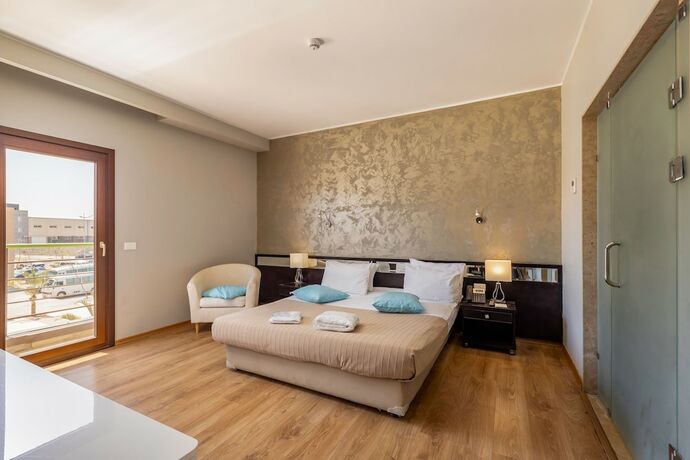 Imagen de la habitación del Hotel Dhara Residence E2 Lodge. Foto 23