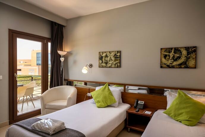 Imagen de la habitación del Hotel Dhara Residence E2 Lodge. Foto 26