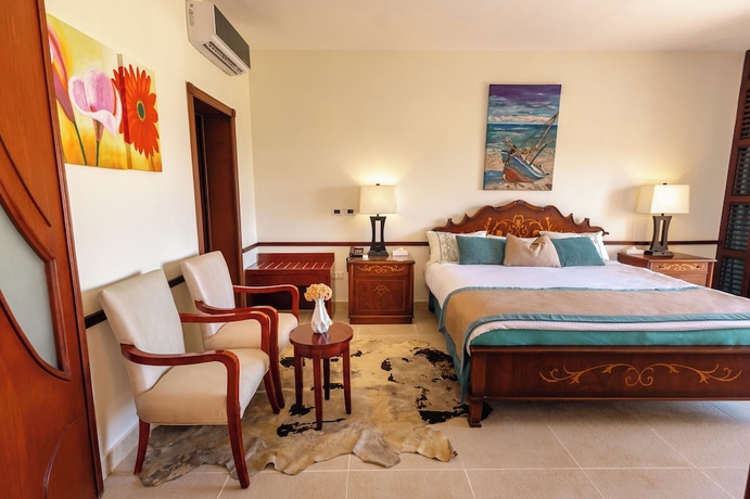 Imagen de la habitación del Hotel Dhara Residence Grand Waha. Foto 2
