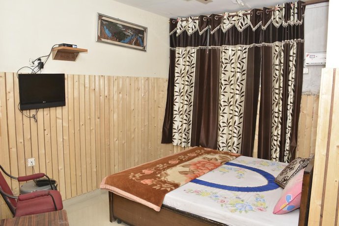 Imagen de la habitación del Hotel Dharam Villa. Foto 9