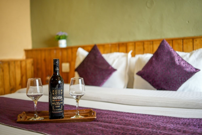 Imagen de la habitación del Hotel Dharamshala Village Resort. Foto 3