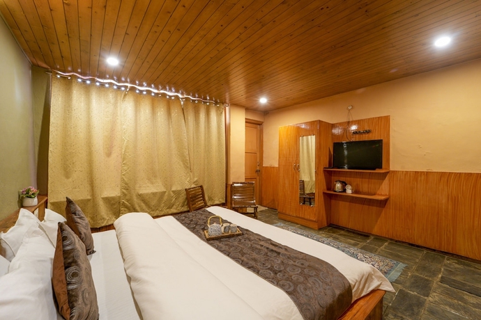 Imagen de la habitación del Hotel Dharamshala Village Resort. Foto 7