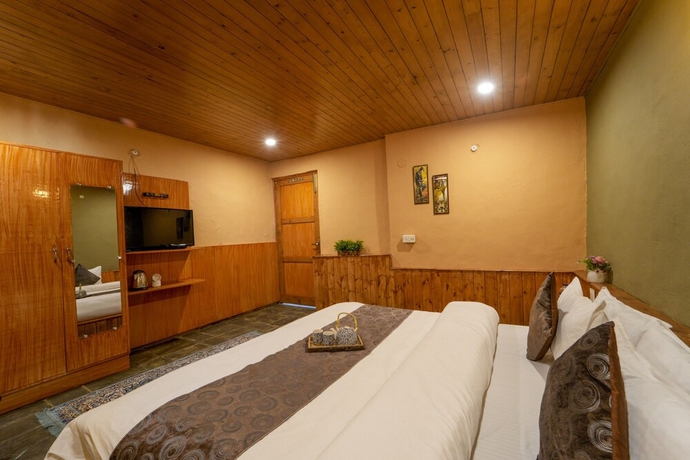 Imagen de la habitación del Hotel Dharamshala Village Resort. Foto 8