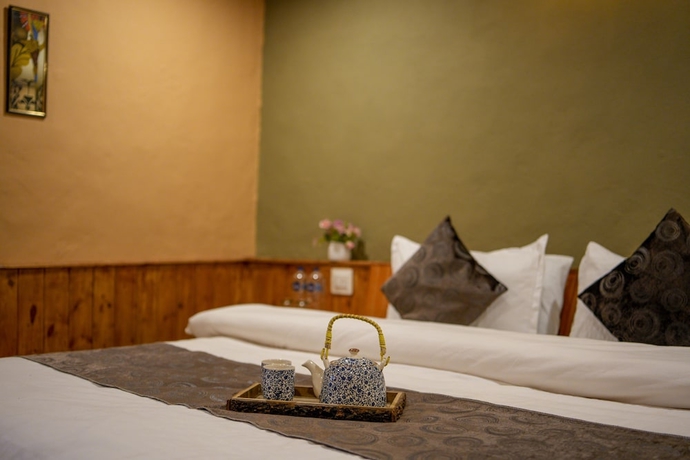 Imagen de la habitación del Hotel Dharamshala Village Resort. Foto 9