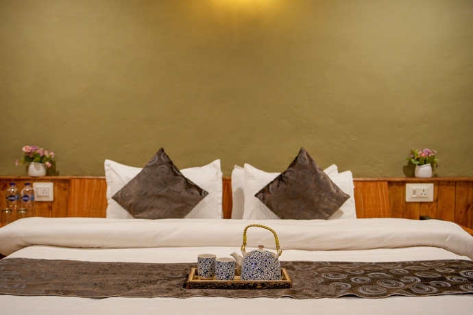 Imagen de la habitación del Hotel Dharamshala Village Resort. Foto 11