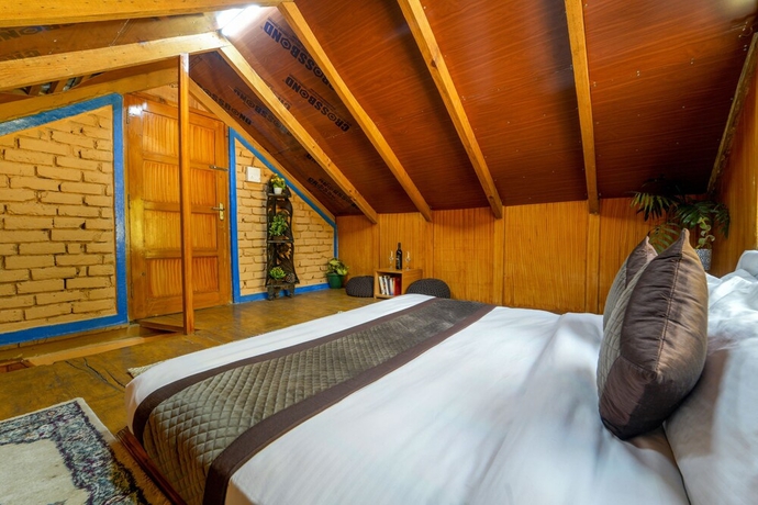 Imagen de la habitación del Hotel Dharamshala Village Resort. Foto 14