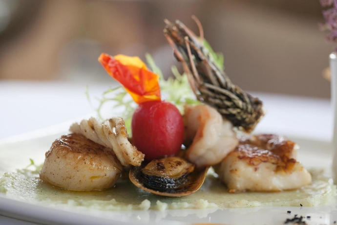 Imagen del bar/restaurante del Hotel Dhevatara Beach. Foto 4