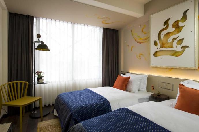 Imagen de la habitación del Hotel Dhevi Bangkok. Foto 6
