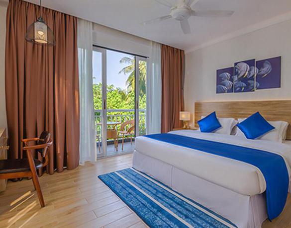 Imagen de la habitación del Hotel Dhiguveli Maldives. Foto 5