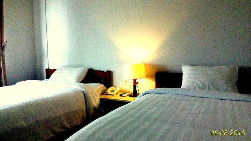 Imagen de la habitación del Hotel Dhyanapura City. Foto 22