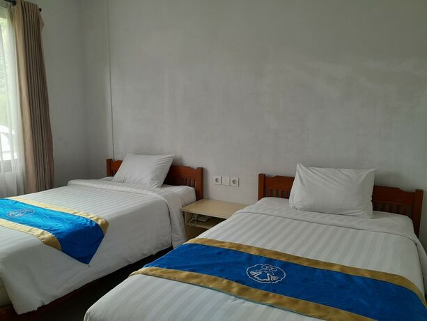Imagen de la habitación del Hotel Dhyanapura City. Foto 23