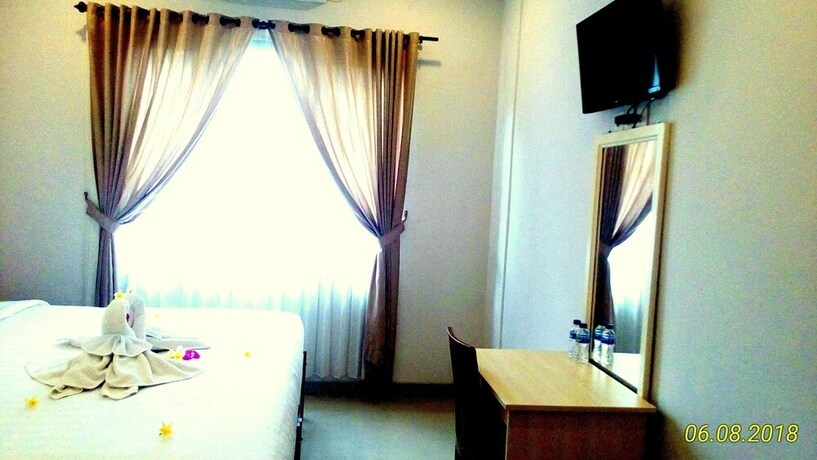 Imagen de la habitación del Hotel Dhyanapura City. Foto 25