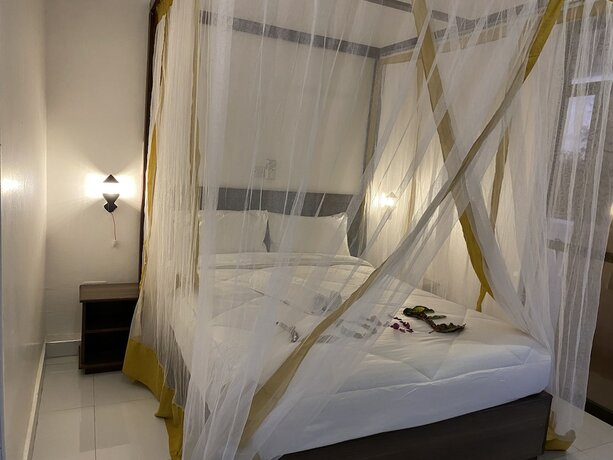Imagen de la habitación del Hotel Diani Palm Resort. Foto 15