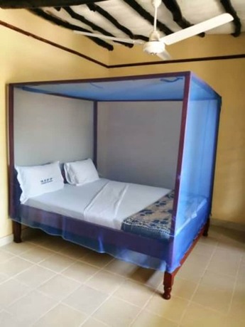 Imagen de la habitación del Hotel Diani Travelers Guest House. Foto 19