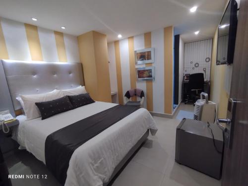 Imagen de la habitación del Hotel Dibeni Pereira. Foto 20