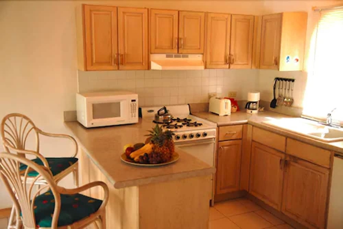 Imagen de la habitación del Hotel Dickenson Bay Cottages. Foto 10