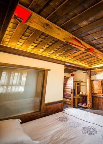 Imagen de la habitación del Hotel Dielianhua Cowherd Inn Zhangjiajie. Foto 7