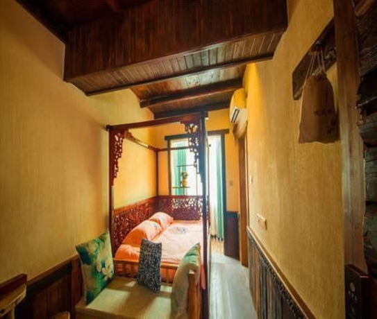 Imagen de la habitación del Hotel Dielianhua Cowherd Inn Zhangjiajie. Foto 8