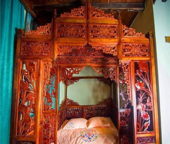 Imagen de la habitación del Hotel Dielianhua Cowherd Inn Zhangjiajie. Foto 9
