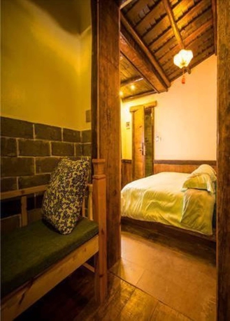 Imagen de la habitación del Hotel Dielianhua Cowherd Inn Zhangjiajie. Foto 10