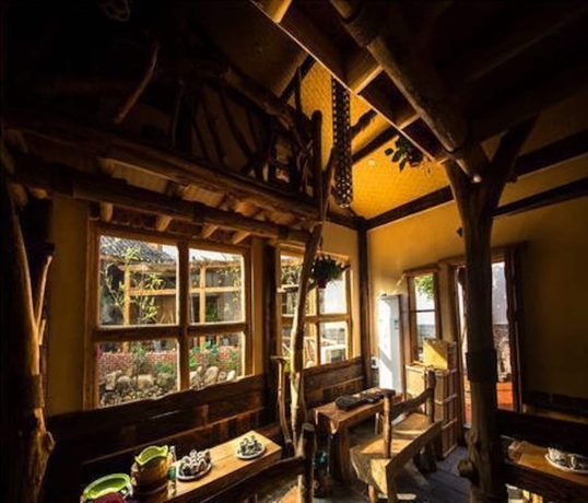 Imagen del bar/restaurante del Hotel Dielianhua Cowherd Inn Zhangjiajie. Foto 4