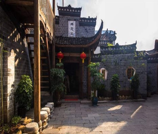 Imagen de los exteriores del Hotel Dielianhua Cowherd Inn Zhangjiajie. Foto 17