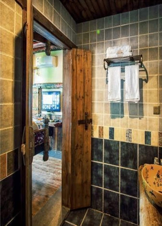 Imagen de la habitación del Hotel Dielianhua Cowherd Inn Zhangjiajie. Foto 12