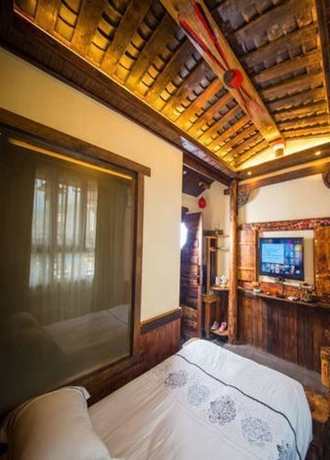 Imagen de la habitación del Hotel Dielianhua Cowherd Inn Zhangjiajie. Foto 13