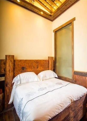 Imagen de la habitación del Hotel Dielianhua Cowherd Inn Zhangjiajie. Foto 16